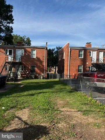 a view of a house next to a yard