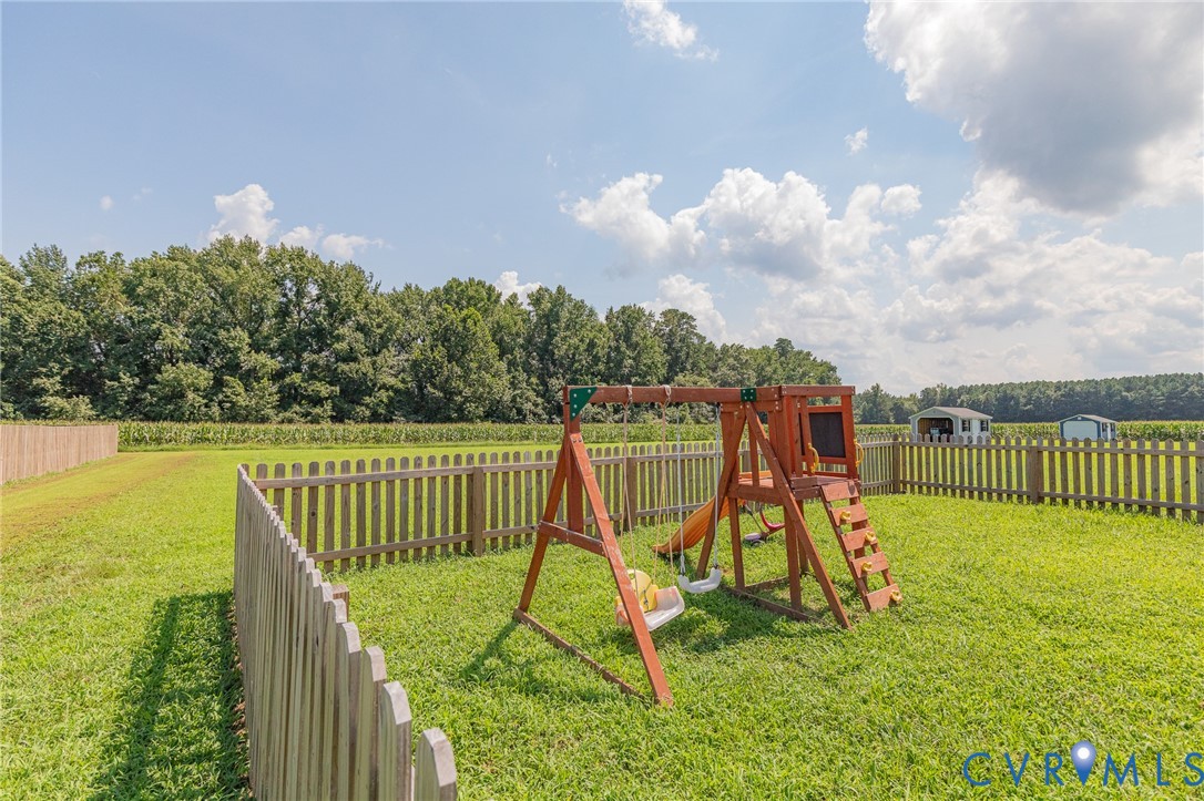 1018 Eubanks Road Dunnsville, VA 22454 - Photo 20 of 26 a view of a roof deck with a slide and swing