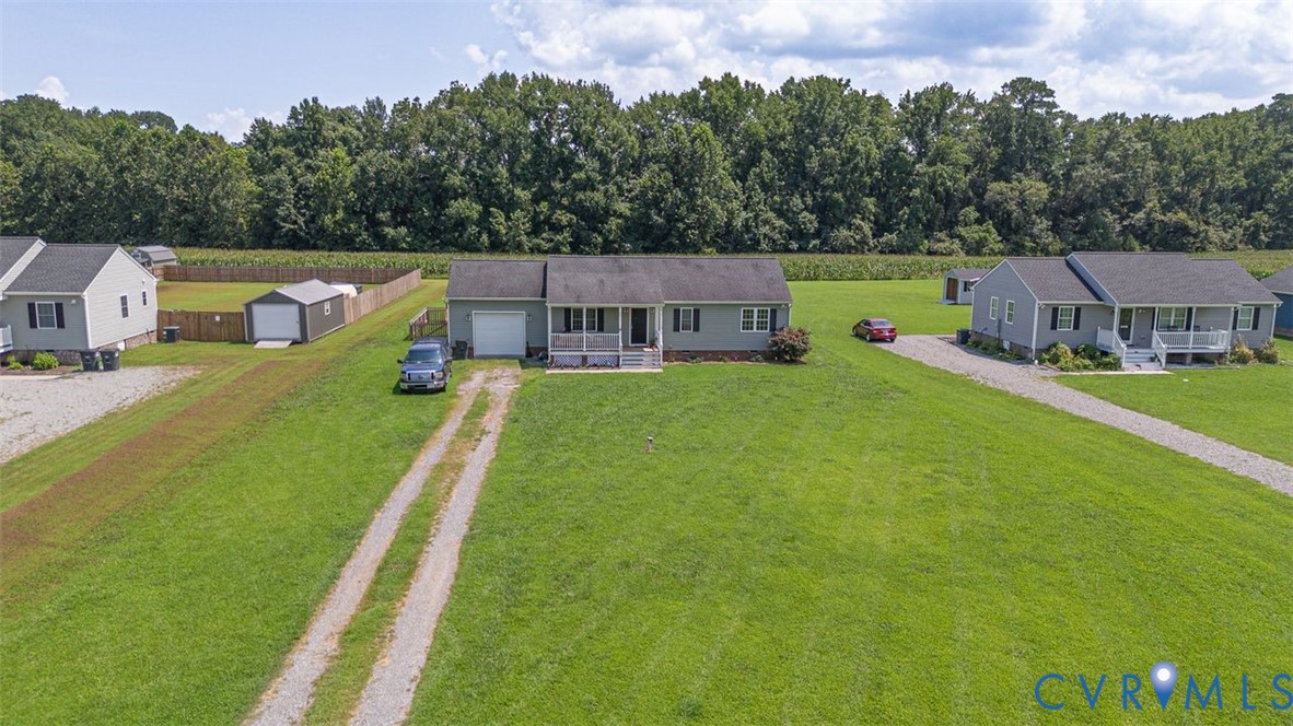 1018 Eubanks Road Dunnsville, VA 22454 - Photo 2 of 26 an aerial view of a house