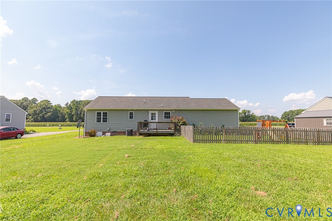 1018 Eubanks Road Dunnsville, VA 22454 - Photo 22 of 26 a view of a house with a yard and a large tree