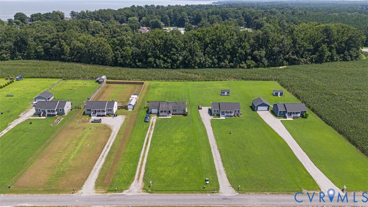 1018 Eubanks Road Dunnsville, VA 22454 - Photo 23 of 26 a view of a swimming pool with a yard