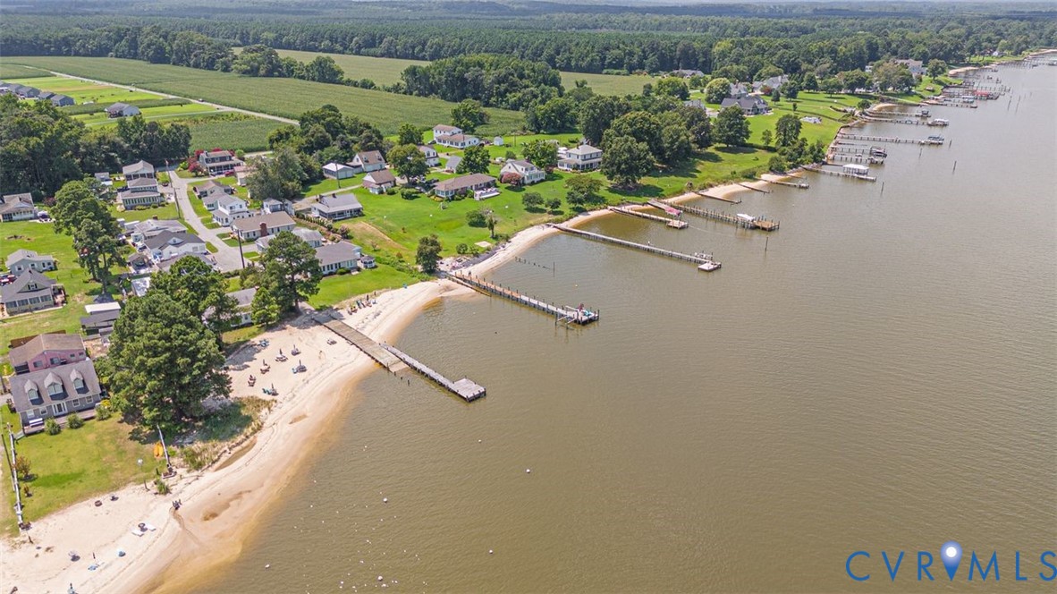 1018 Eubanks Road Dunnsville, VA 22454 - Photo 25 of 26 an aerial view of a house with a yard and lake view