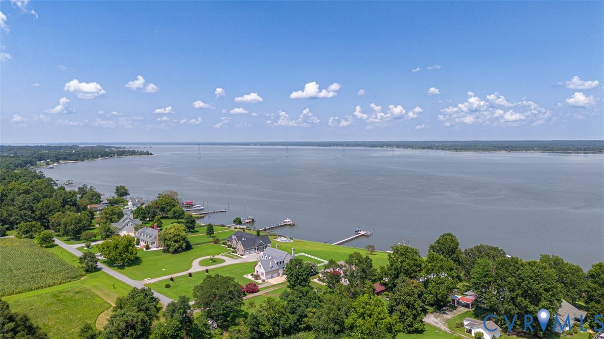 1018 Eubanks Road Dunnsville, VA 22454 - Photo 26 of 26 a sunset view with lake view and a lake view