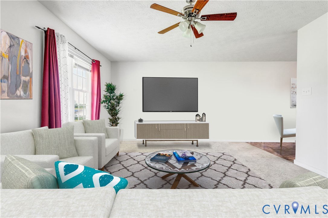 1018 Eubanks Road Dunnsville, VA 22454 - Photo 5 of 26 a living room with furniture and a flat screen tv