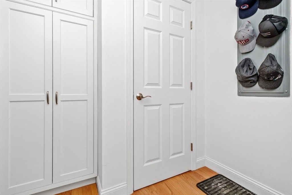 29 Spruce Street, Unit 23 Waltham, MA 02453 - Photo 20 of 26 a view of an entryway with wooden floor