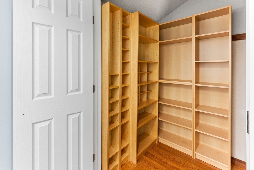 511 Tumbling Hawk, Unit 511 Acton, MA 01718 - Photo 19 of 42 a view of walk in closet with empty racks