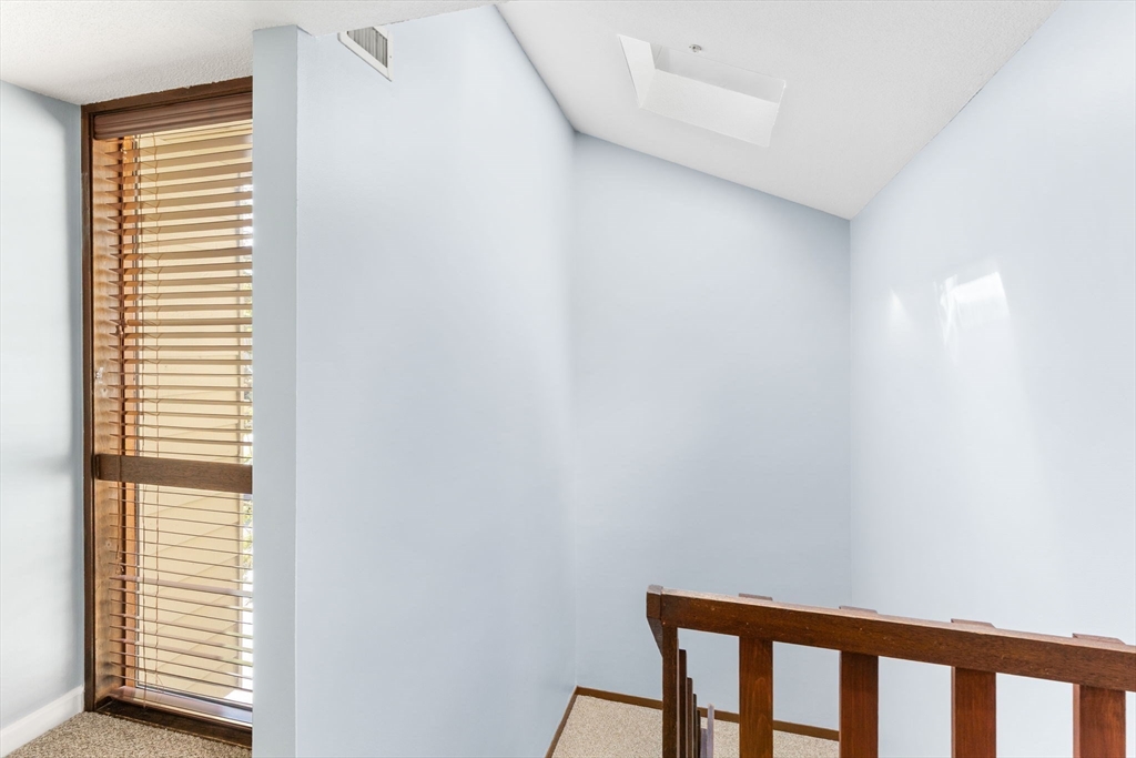 511 Tumbling Hawk, Unit 511 Acton, MA 01718 - Photo 23 of 42 a view of a room that has a window in it