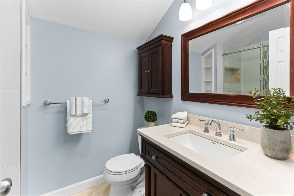 511 Tumbling Hawk, Unit 511 Acton, MA 01718 - Photo 24 of 42 a bathroom with a sink and a toilet