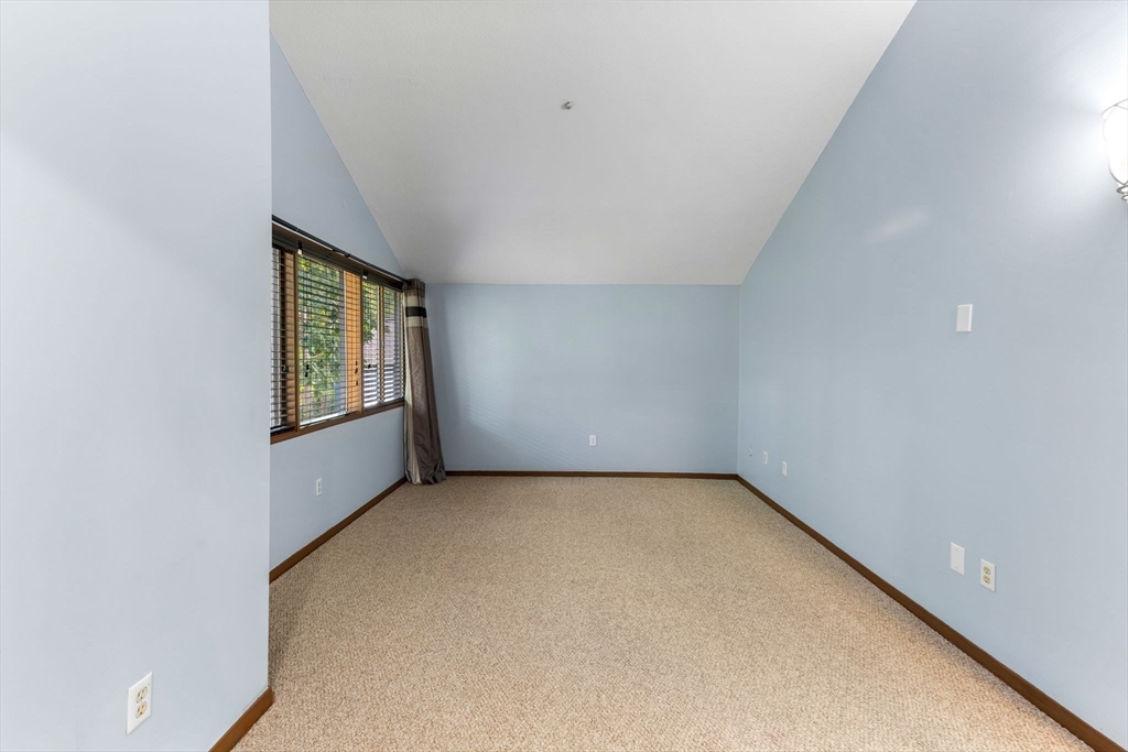 511 Tumbling Hawk, Unit 511 Acton, MA 01718 - Photo 26 of 42 an empty room with windows