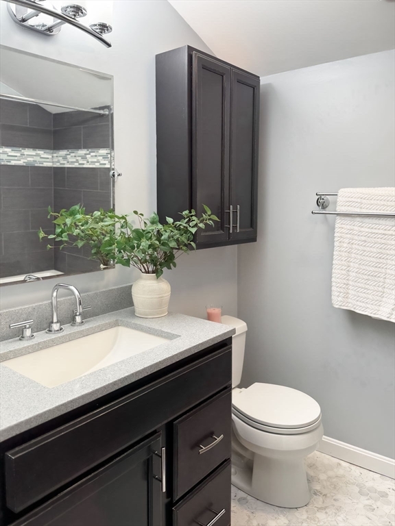 511 Tumbling Hawk, Unit 511 Acton, MA 01718 - Photo 30 of 42 a bathroom with a sink and a mirror
