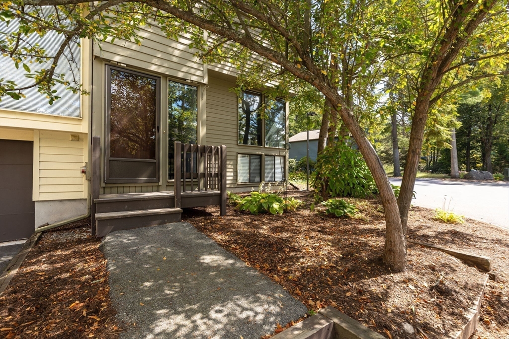 511 Tumbling Hawk, Unit 511 Acton, MA 01718 - Photo 3 of 42 a view of a house with a yard