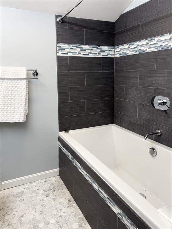 511 Tumbling Hawk, Unit 511 Acton, MA 01718 - Photo 31 of 42 a bathroom with a bathtub and shower