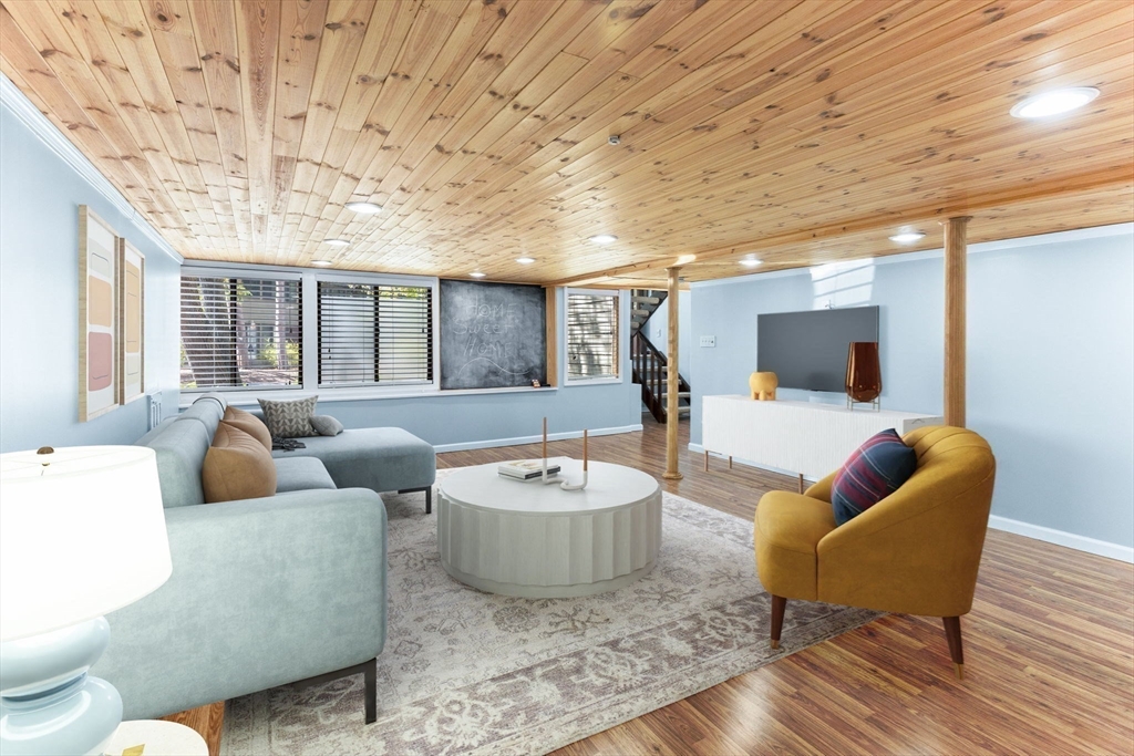 511 Tumbling Hawk, Unit 511 Acton, MA 01718 - Photo 34 of 42 a living room with furniture and a flat screen tv