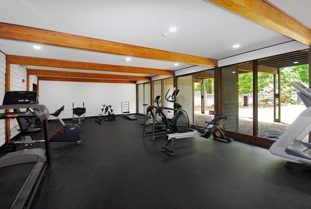 511 Tumbling Hawk, Unit 511 Acton, MA 01718 - Photo 41 of 42 a view of a room with gym equipment
