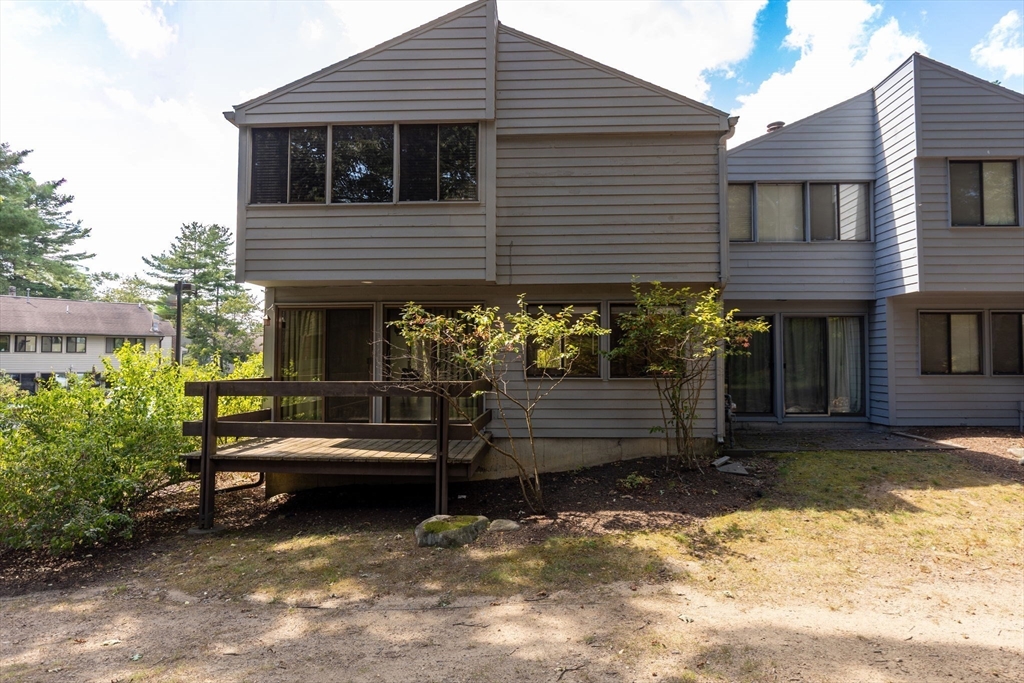 511 Tumbling Hawk, Unit 511 Acton, MA 01718 - Photo 7 of 42 a view of a house with a yard