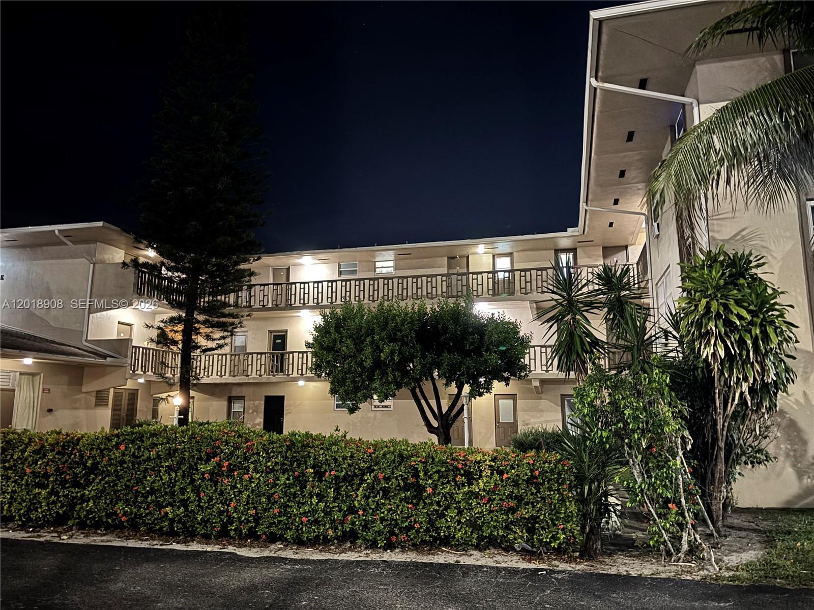 1480 East Sample Road, Unit 209 Pompano Beach, FL 33064 - Photo 24 of 24 a view of a tall building in front of it