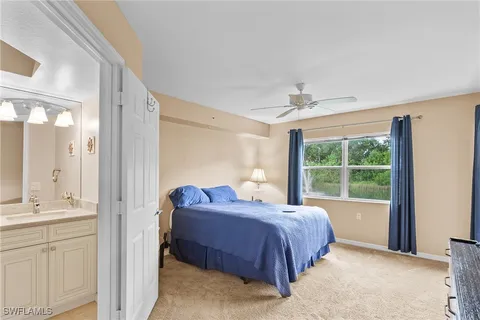 a spacious bedroom with a bed and a window