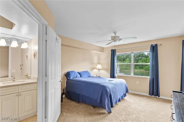 a spacious bedroom with a bed and a window