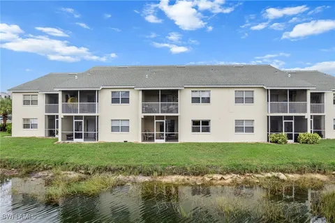 a front view of a building with a garden