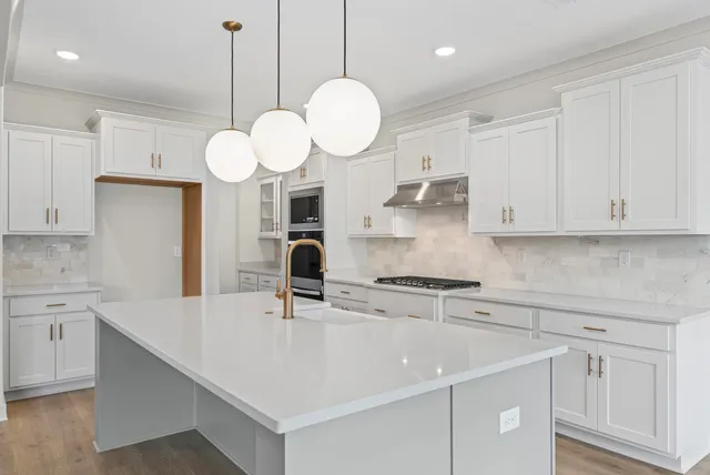 a kitchen with a sink cabinets and window