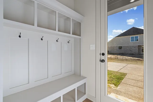 an empty room with a empty space and windows