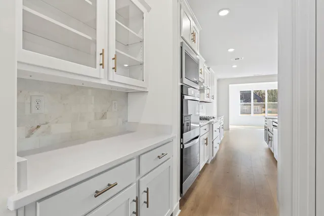 a hallway with cabinets