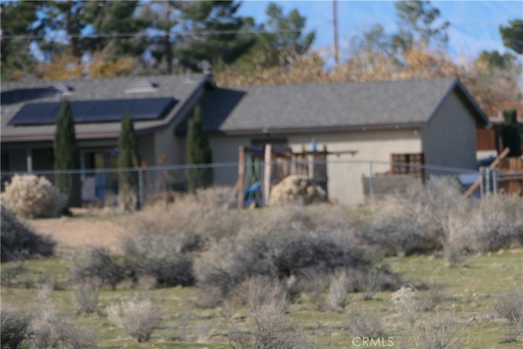 0 Passo Road Apple Valley, CA 92308 - Photo 4 of 16 a view of a house with a yard