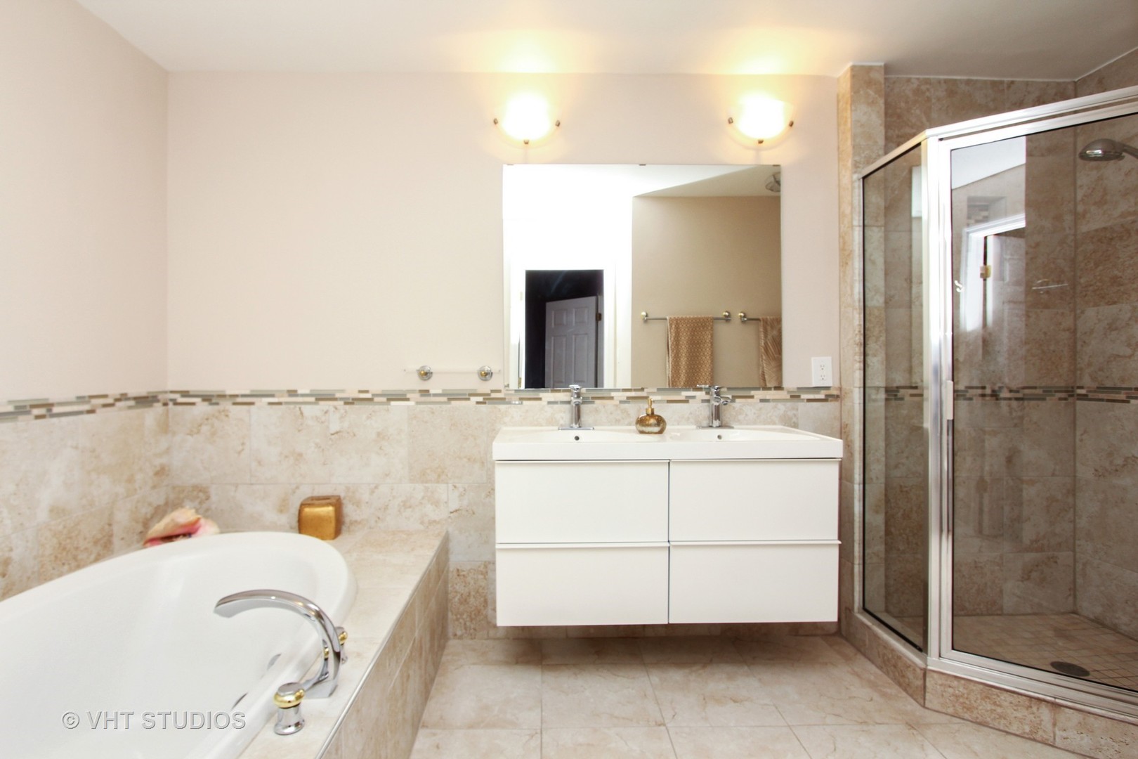 1104 Devonshire Road Buffalo Grove, IL 60089 - Photo 6 of 10 a bathroom with a tub sink and mirror