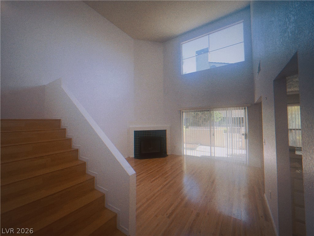 6250 West Flamingo Road, Unit 60 Las Vegas, NV 89103 - Photo 2 of 23 This airy living space features soaring ceilings, a fireplace, and access to the outdoors.