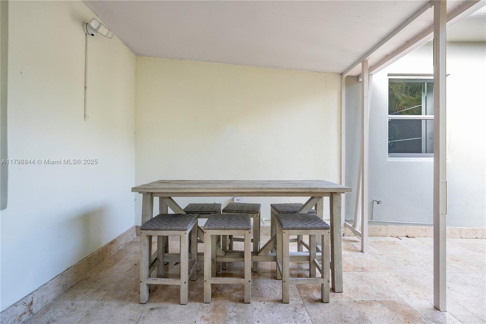 9025 Hawthorne Avenue Surfside, FL 33154 - Photo 14 of 58 a view of a room with table and chair