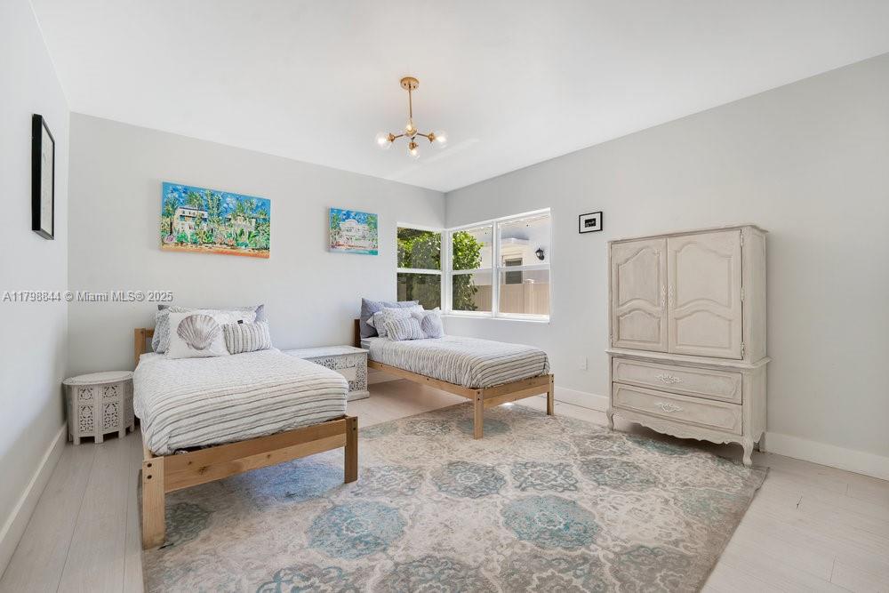9025 Hawthorne Avenue Surfside, FL 33154 - Photo 20 of 58 a bedroom with furniture and a window