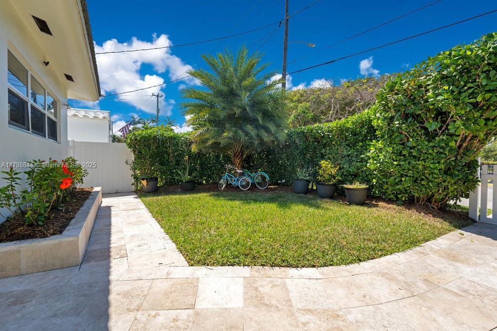9025 Hawthorne Avenue Surfside, FL 33154 - Photo 3 of 58 a view of a swimming pool with a patio