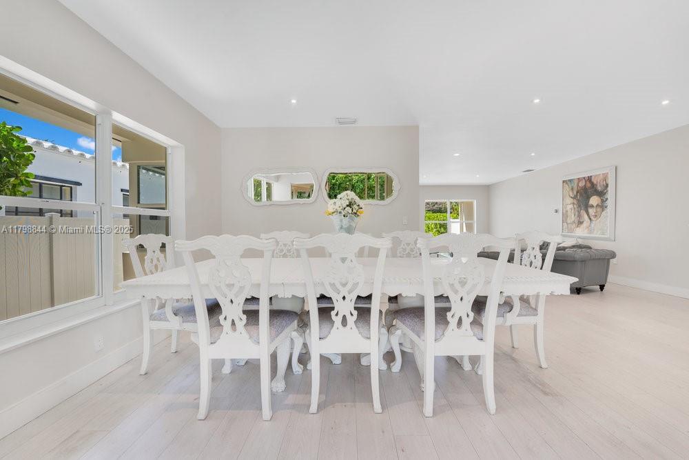9025 Hawthorne Avenue Surfside, FL 33154 - Photo 33 of 58 a view of a dining room with furniture and wooden floor