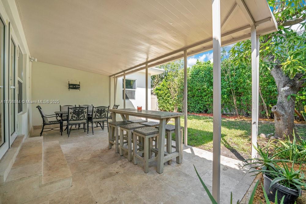 9025 Hawthorne Avenue Surfside, FL 33154 - Photo 37 of 58 a view of a dining room with furniture window and outside view