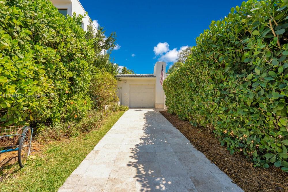 9025 Hawthorne Avenue Surfside, FL 33154 - Photo 42 of 58 a view of a backyard with pathway