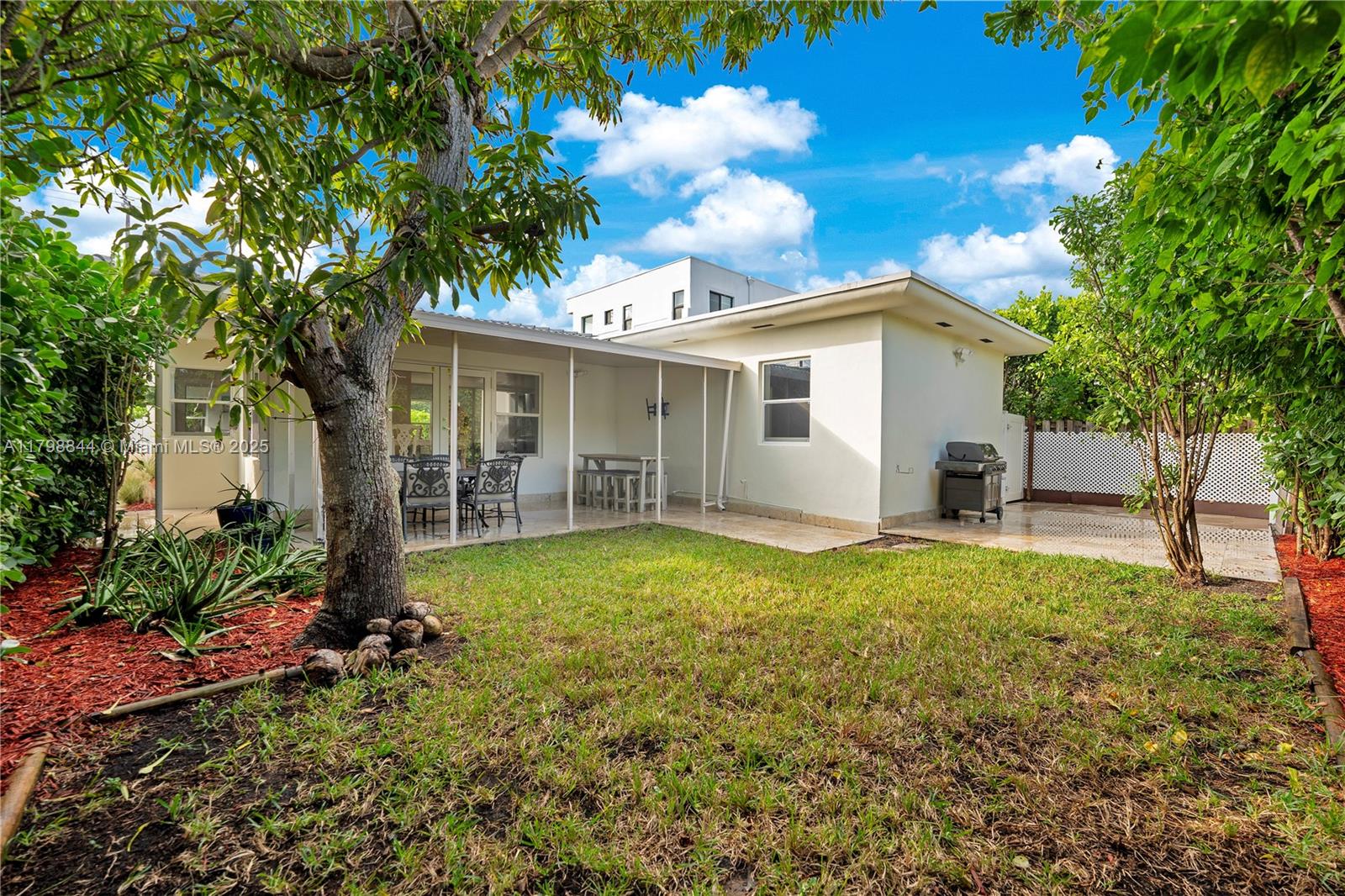 9025 Hawthorne Avenue Surfside, FL 33154 - Photo 53 of 58 a view of a house with backyard and sitting area