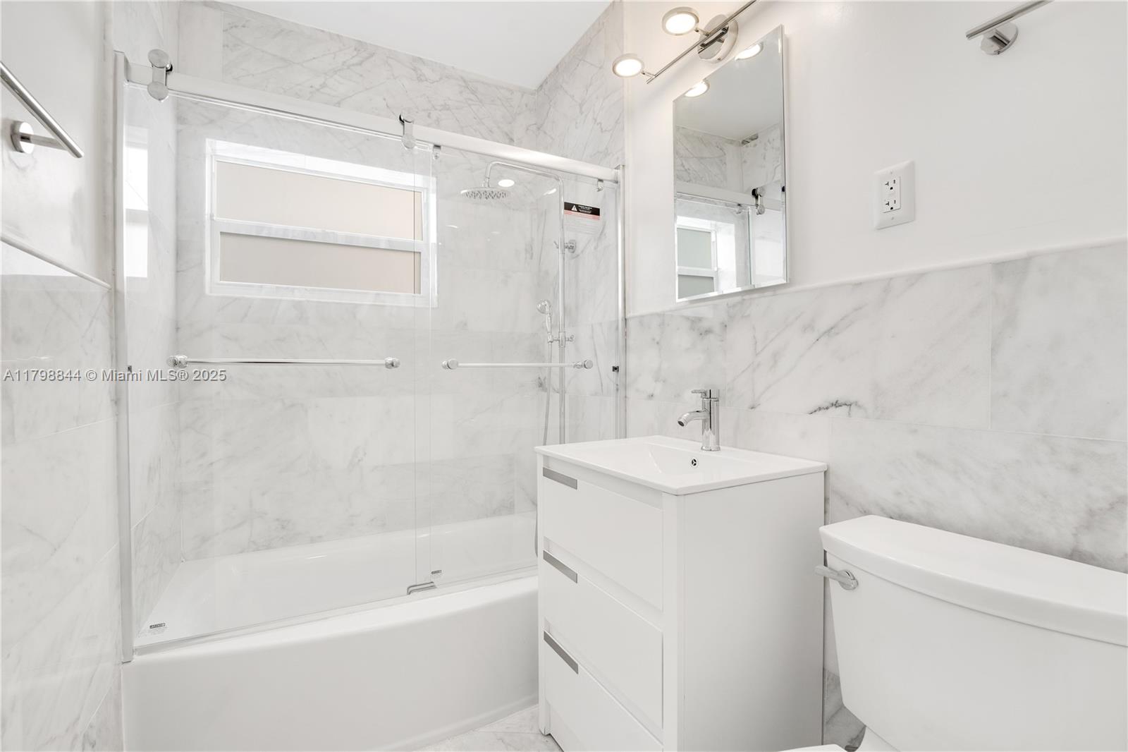 9025 Hawthorne Avenue Surfside, FL 33154 - Photo 9 of 58 a bathroom with a sink toilet and shower