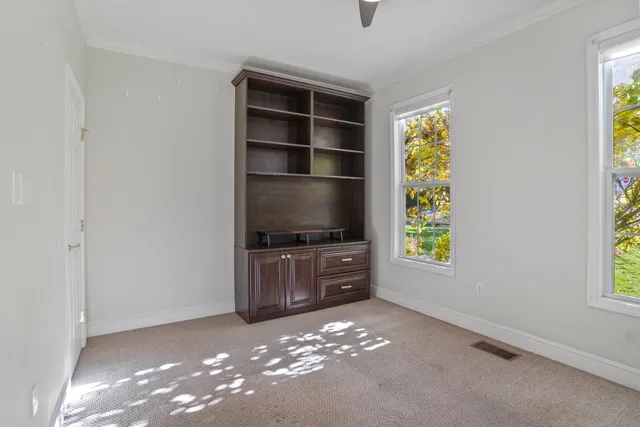 a room with window and furniture