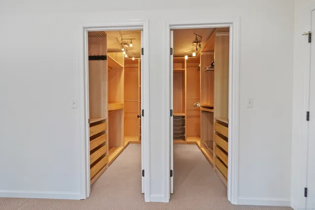 a spacious bathroom with a granite countertop sink and a mirror