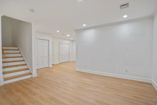 a view of hallway with wooden floor