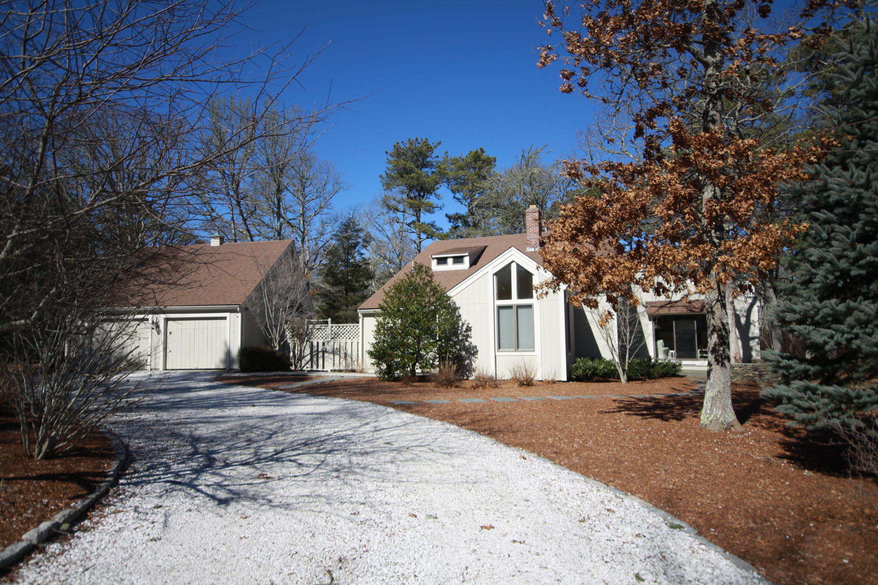 38 Fells Pond Road Mashpee, MA 02649 - Photo 1 of 22 a front view of a house with a yard