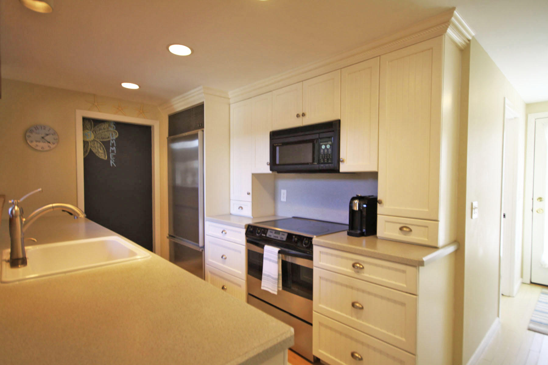 38 Fells Pond Road Mashpee, MA 02649 - Photo 4 of 22 a kitchen with a refrigerator stove and sink