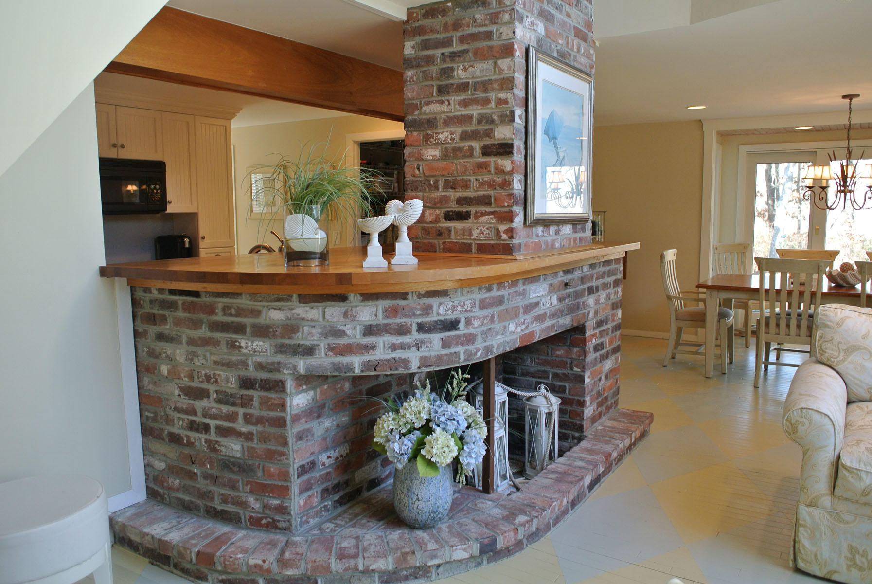 38 Fells Pond Road Mashpee, MA 02649 - Photo 7 of 22 a living room with fireplace furniture and a potted plant