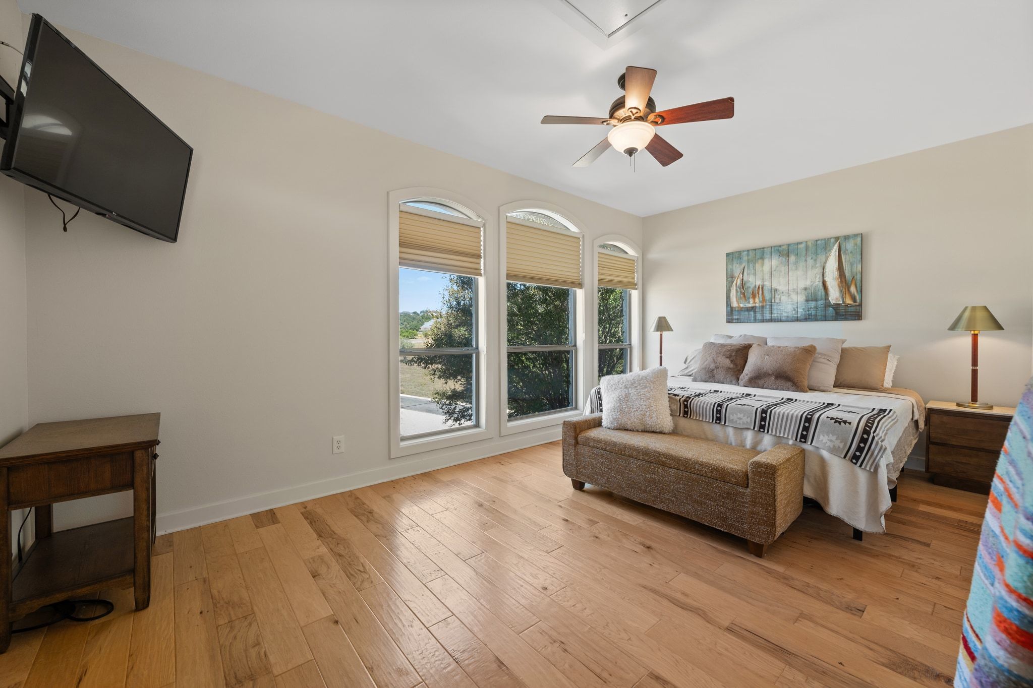 185 Shimmering Shore Court Spring Branch, TX 78070 - Photo 31 of 36 Bedroom with light wood-type flooring and ceiling fan