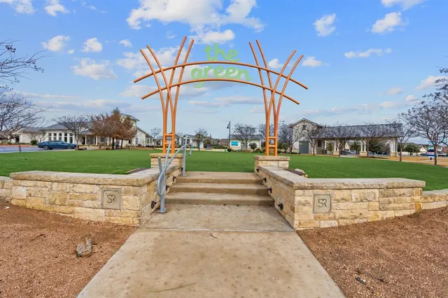 an aerial view of a house with outdoor space