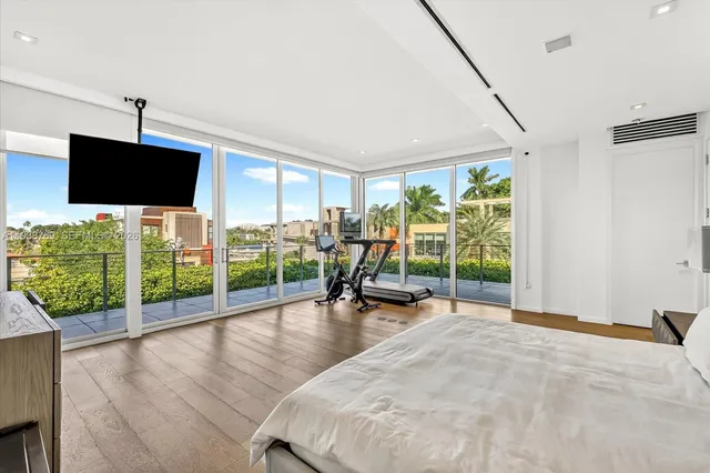 a very nice looking room with a large window and a flat screen tv