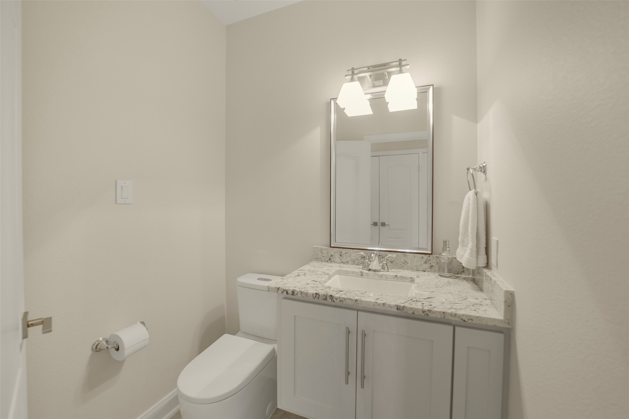 1310 Lambourne Circle Spring, TX 77379 - Photo 40 of 50 Half bath/guest bathroom with granite counter top, custom mirror and Grohe Essence toilet