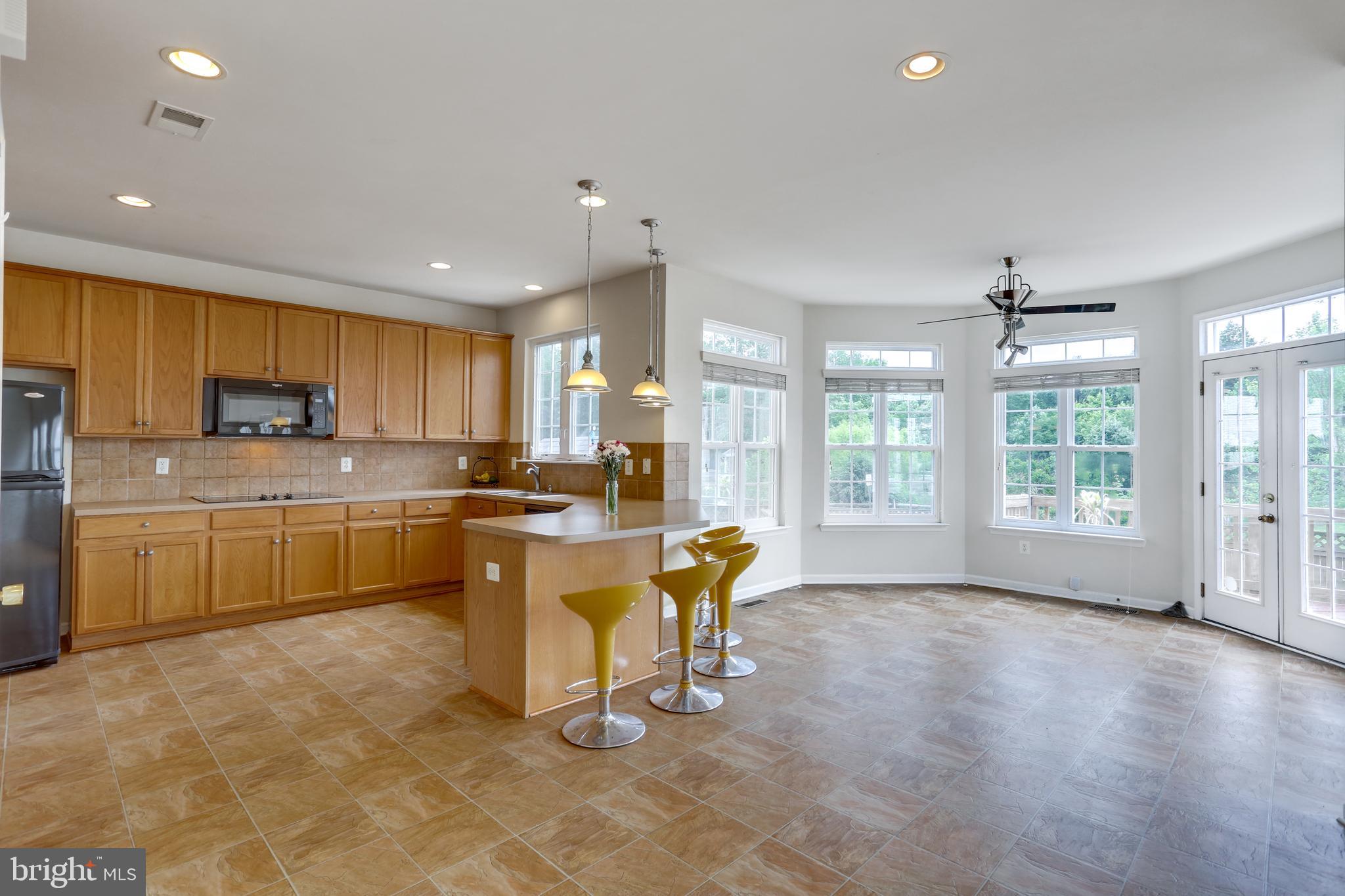 19 Rivers Edge Terrace Indian Head, MD 20640 - Photo 12 of 53 Open hardwood floors from kitchen to family room