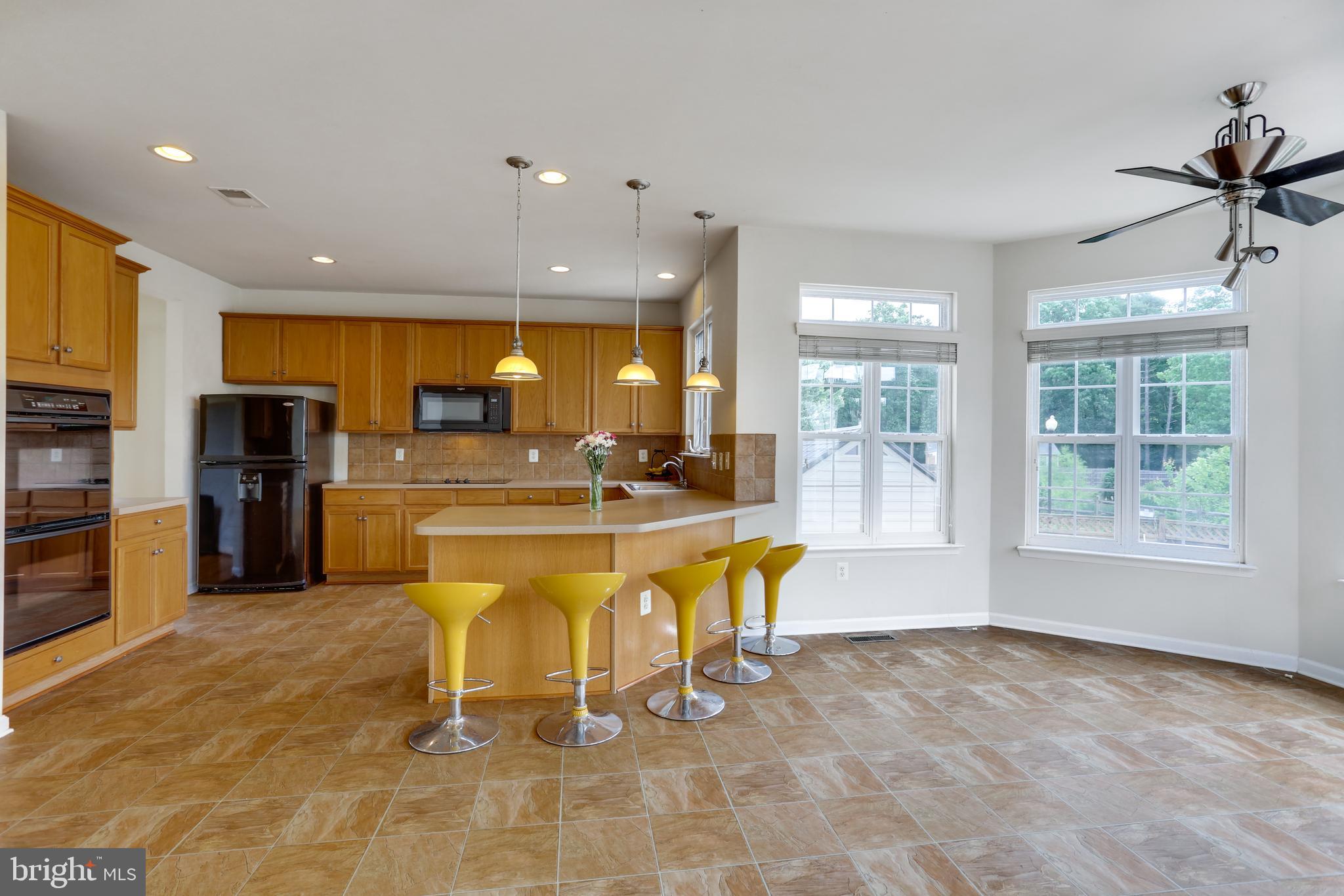 19 Rivers Edge Terrace Indian Head, MD 20640 - Photo 13 of 53 Open hardwood floors from kitchen to family room