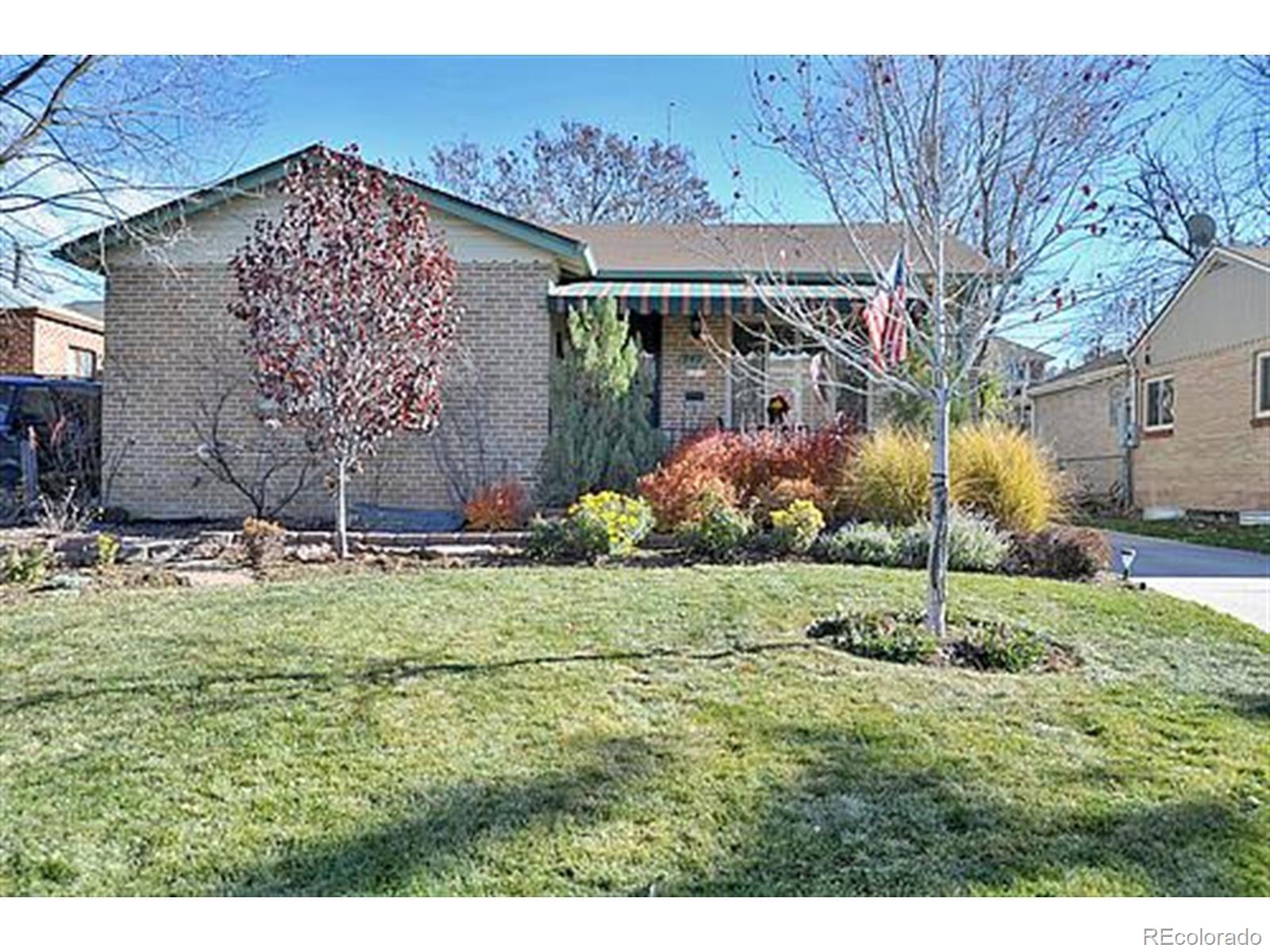 940 Grape Street Denver, CO 80220 - Photo 1 of 50 a backyard of a house with lots of green space